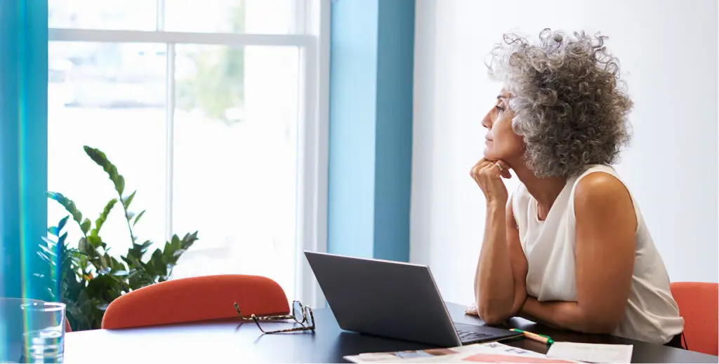 Woman reflecting about business